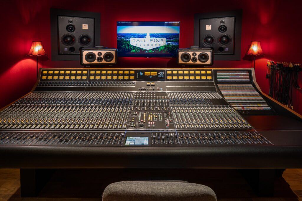 API AXS recording console with red backlighting, Barefoot speakers on meter bridge